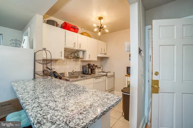 a kitchen with a sink stove and refrigerator