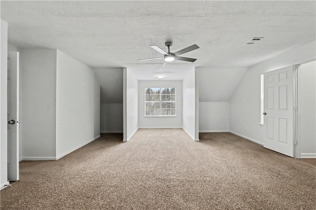 6236 Springwater Lane Lithonia, GA 30058 - Photo 12 of 23 a view of an empty room with a window