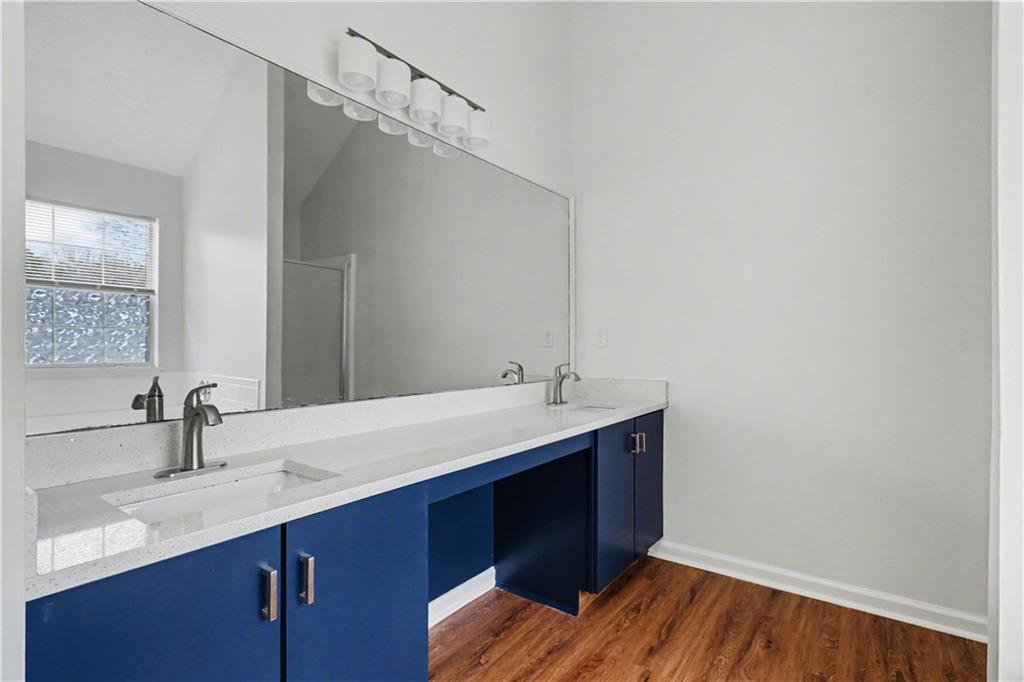 6236 Springwater Lane Lithonia, GA 30058 - Photo 18 of 23 a bathroom with a sink and a mirror
