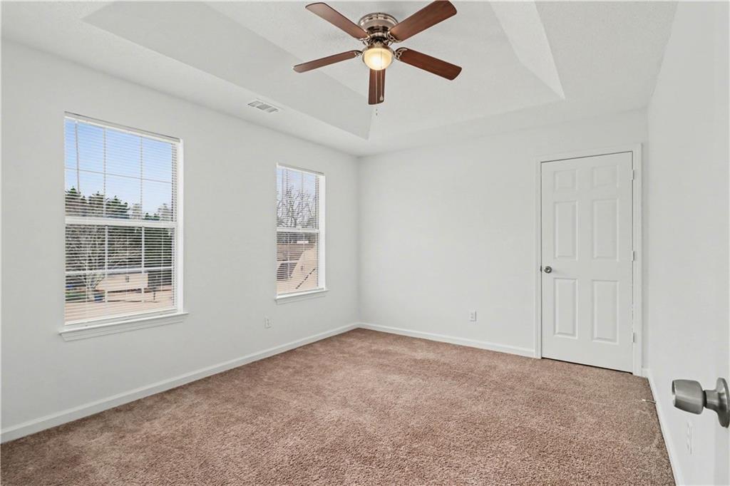 6236 Springwater Lane Lithonia, GA 30058 - Photo 19 of 23 a view of an empty room with a window