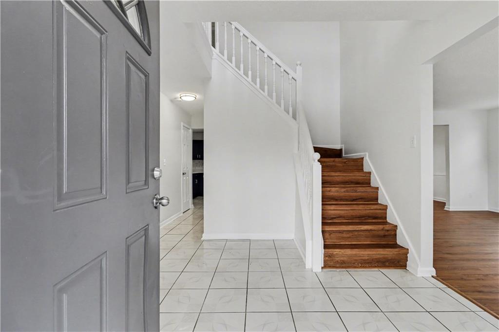 6236 Springwater Lane Lithonia, GA 30058 - Photo 2 of 23 a view of an entryway with stairs