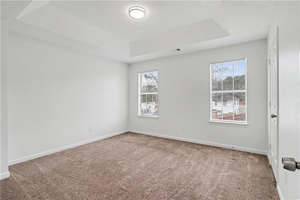 6236 Springwater Lane Lithonia, GA 30058 - Photo 21 of 23 a view of an empty room with a window