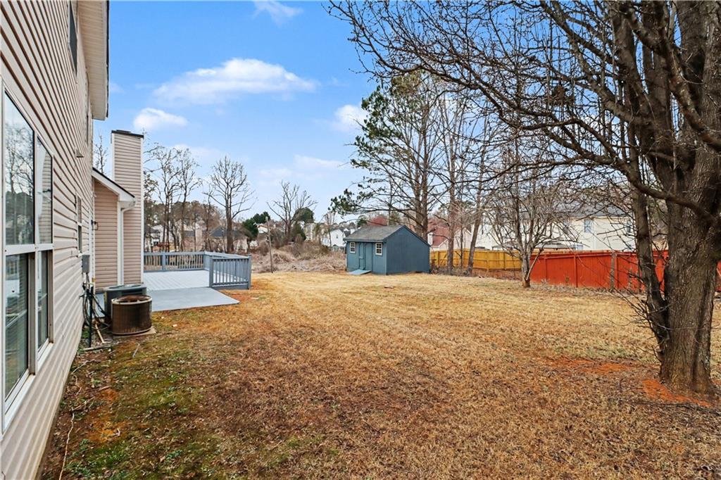 6236 Springwater Lane Lithonia, GA 30058 - Photo 22 of 23 a view of a yard with a house