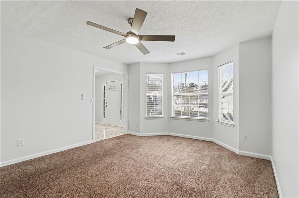 6236 Springwater Lane Lithonia, GA 30058 - Photo 3 of 23 a view of an empty room with a window