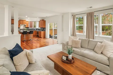 a kitchen with stainless steel appliances granite countertop a sink a stove and a counter space