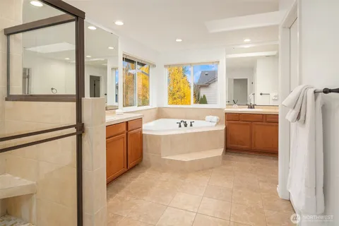 a bedroom with furniture and a large window