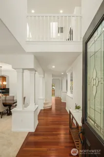 a large white kitchen with a large window