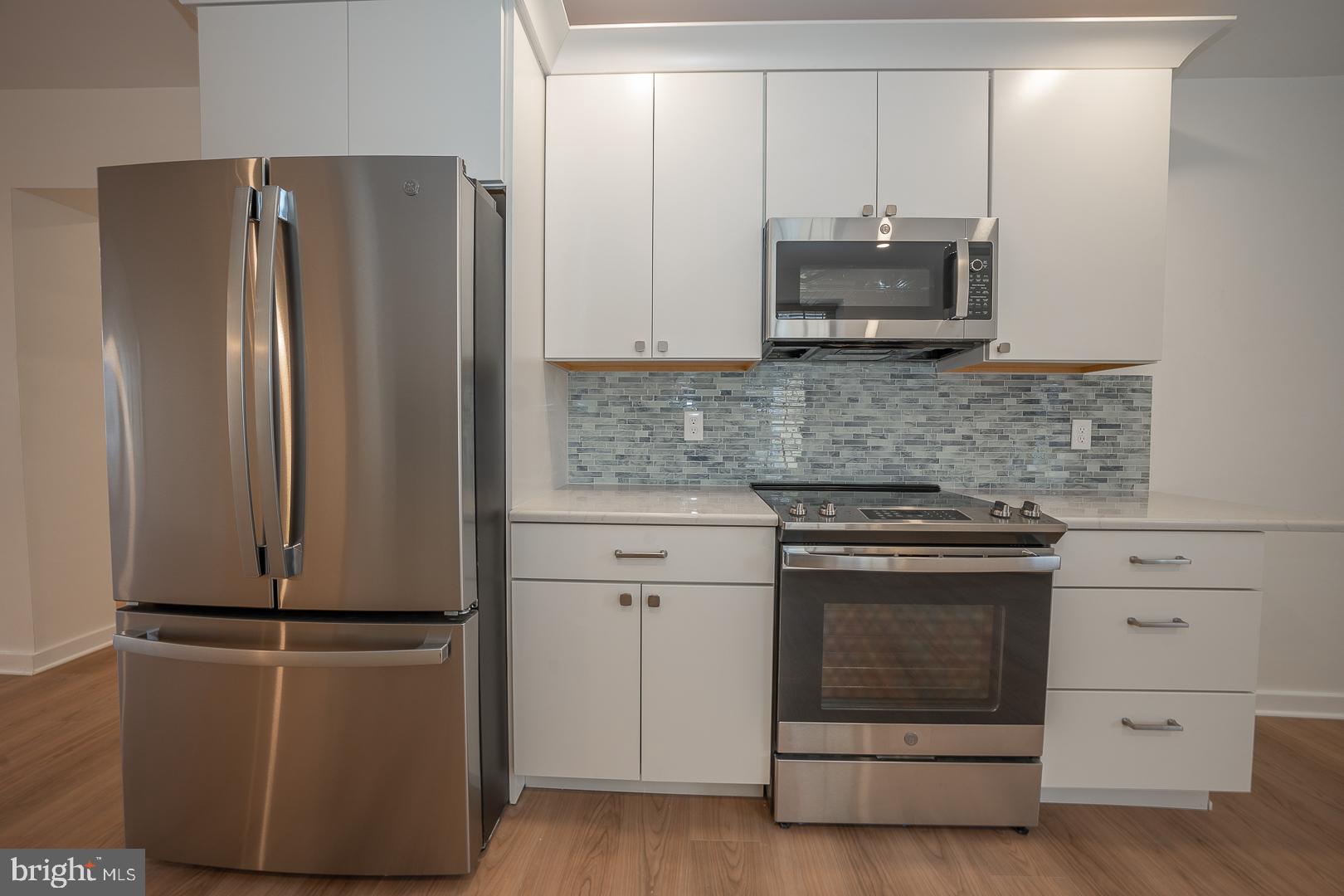 42 North Waterloo Road, Unit 38 Devon, PA 19333 - Photo 4 of 31 Newer kitchen with SS appliances