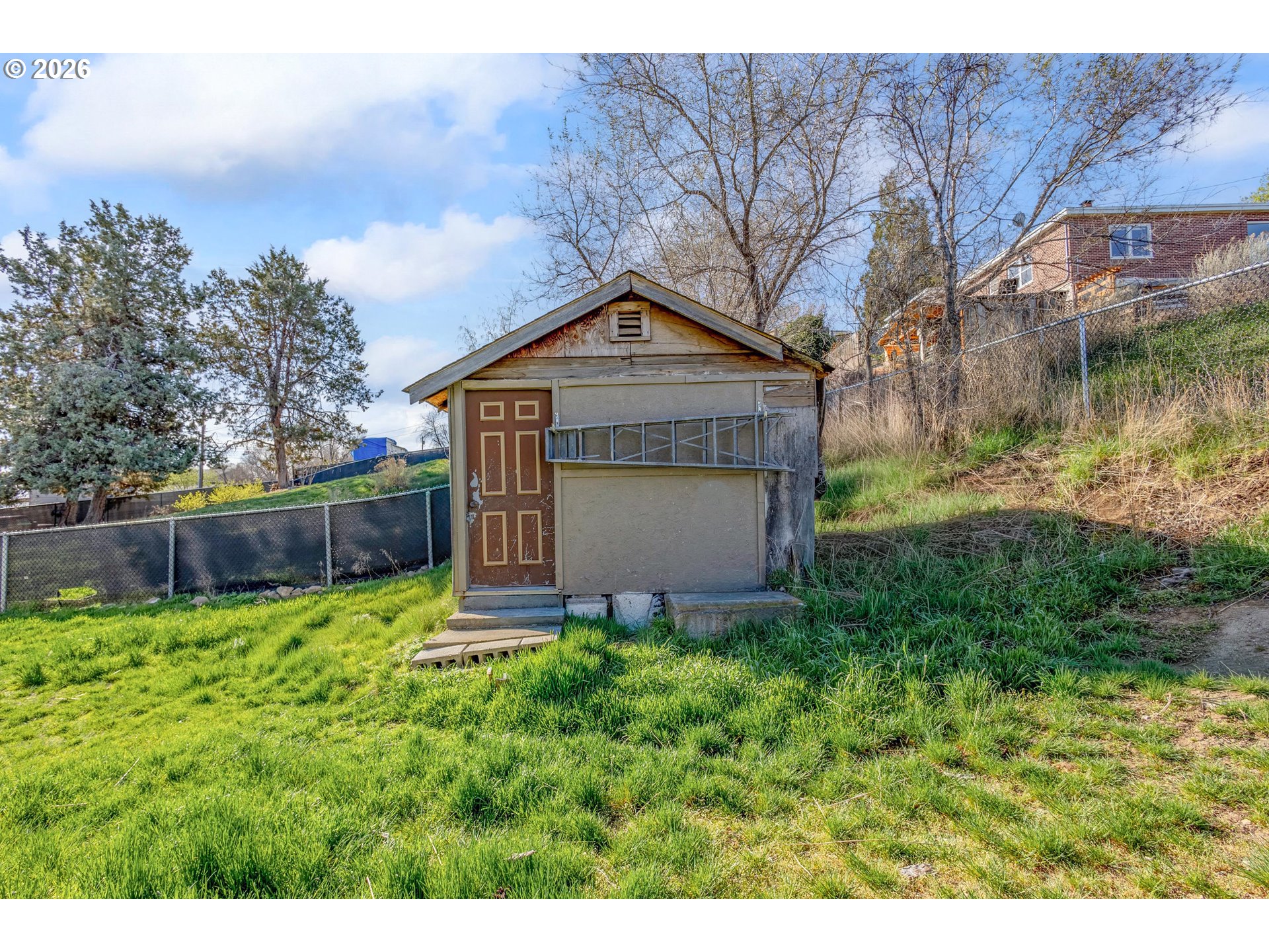342 Southeast 7th Street Madras, OR 97741 - Photo 18 of 22 a pathway of a house with a yard
