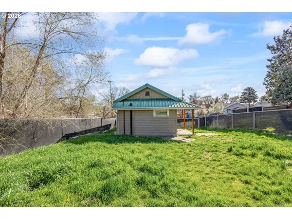 a backyard of a house with lots of green space