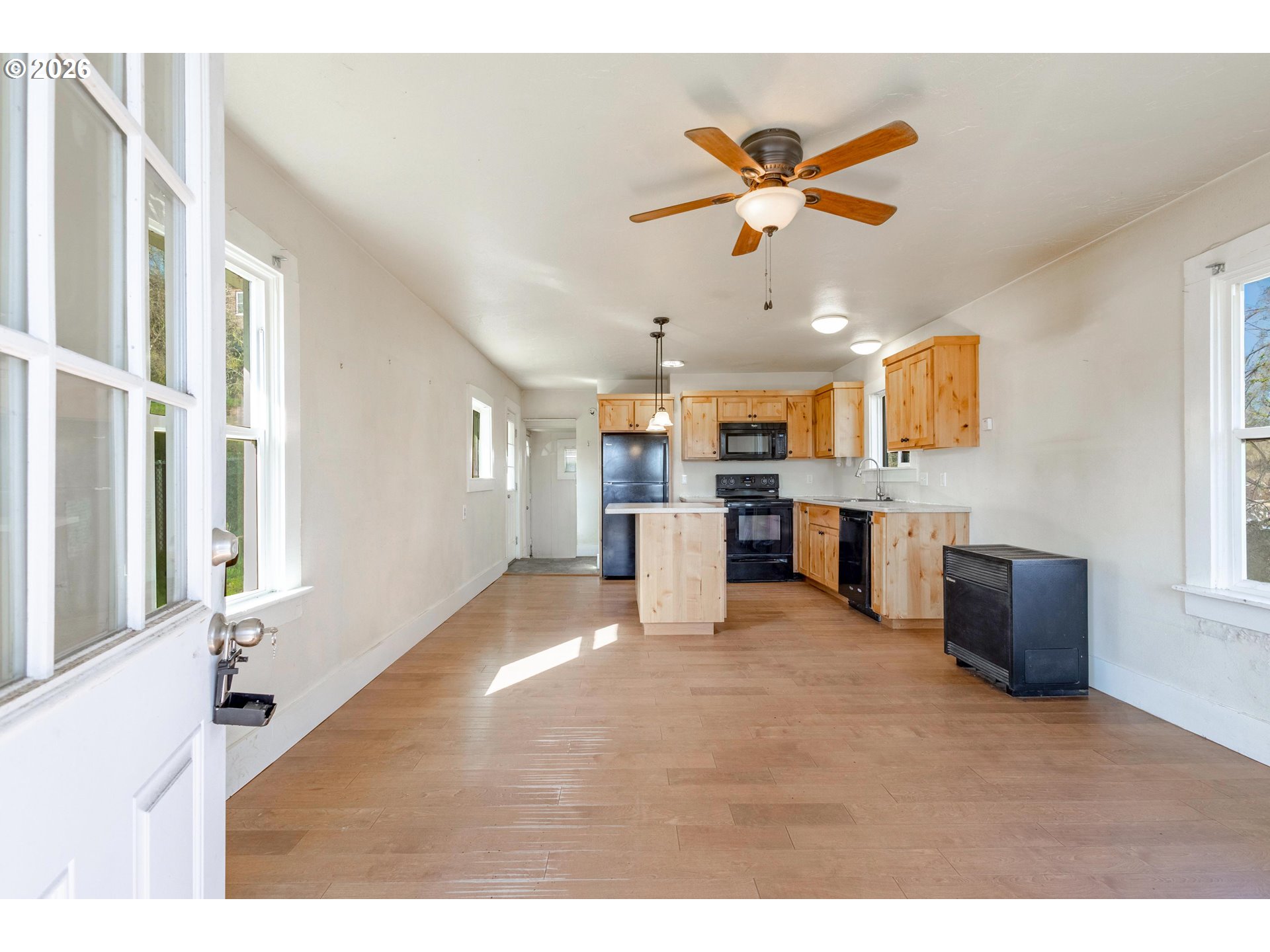 342 Southeast 7th Street Madras, OR 97741 - Photo 2 of 22 a view of kitchen with furniture and wooden floor