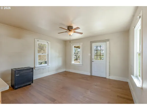 a view of an empty room with a window