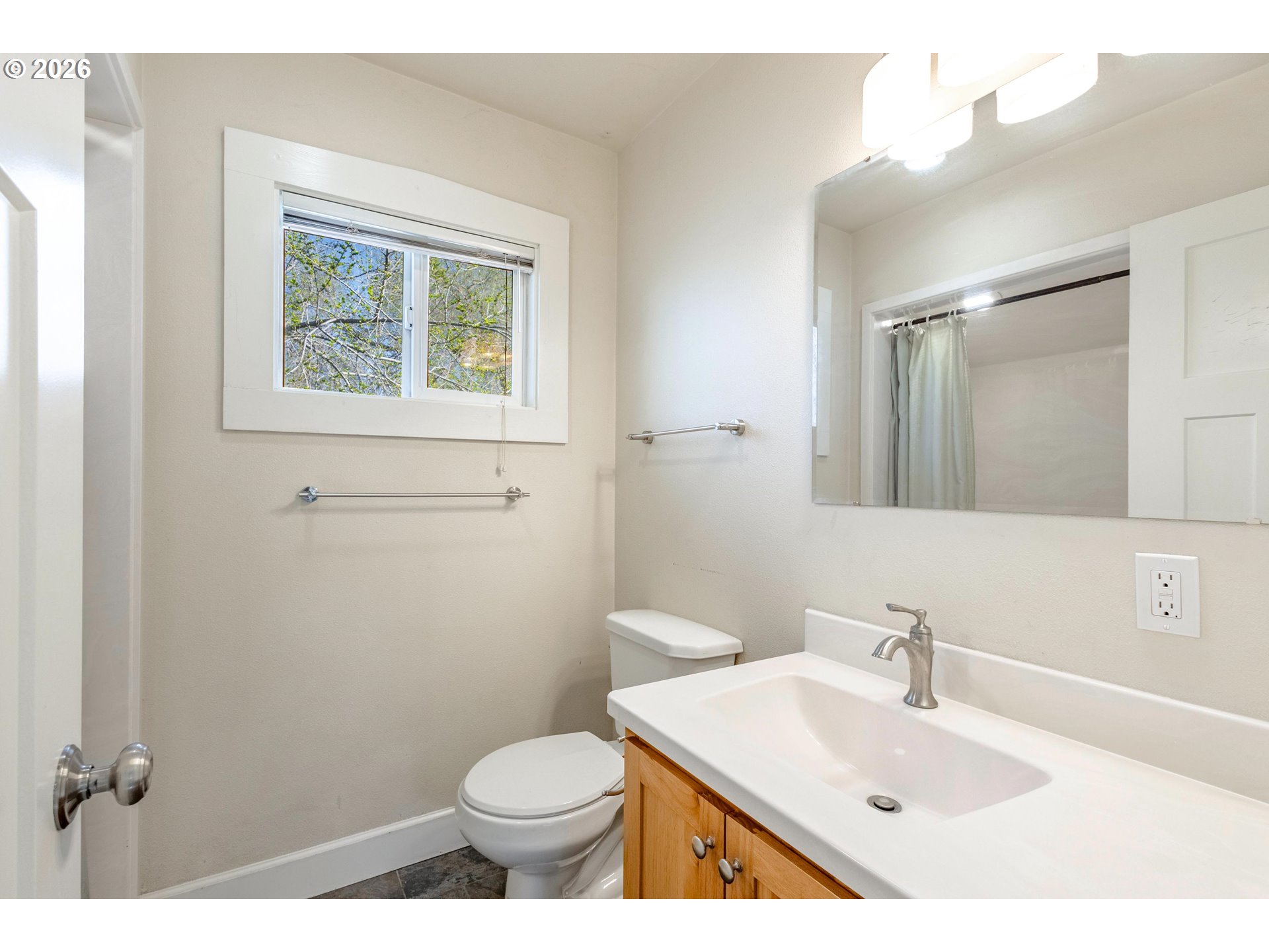 342 Southeast 7th Street Madras, OR 97741 - Photo 9 of 22 a bathroom with a sink mirror vanity and toilet