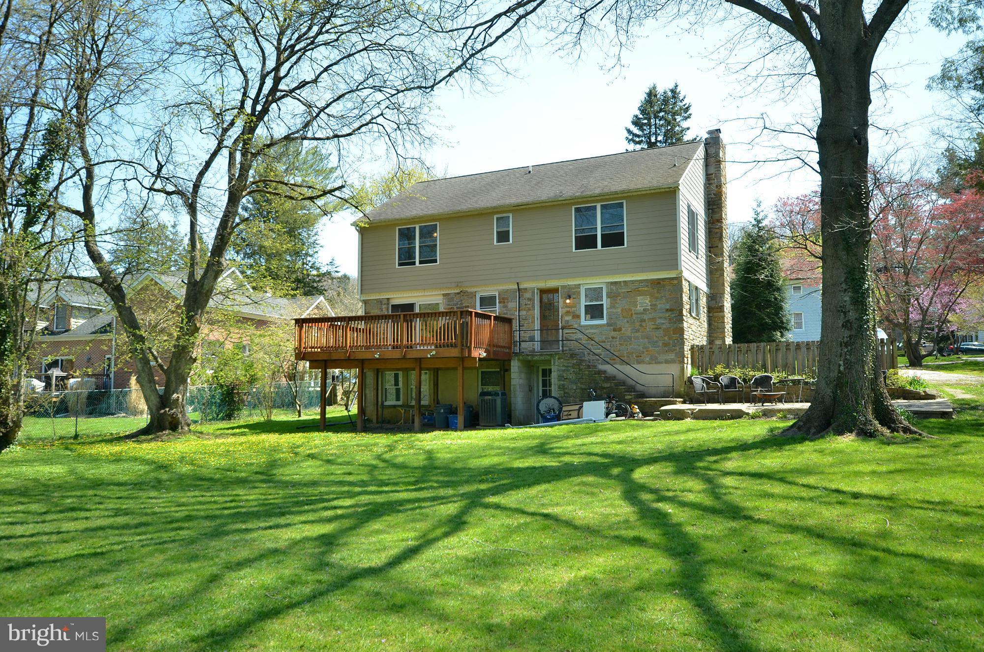 8010 Rider Avenue Baltimore, MD 21204 - Photo 2 of 29 a front view of a house with garden and trees