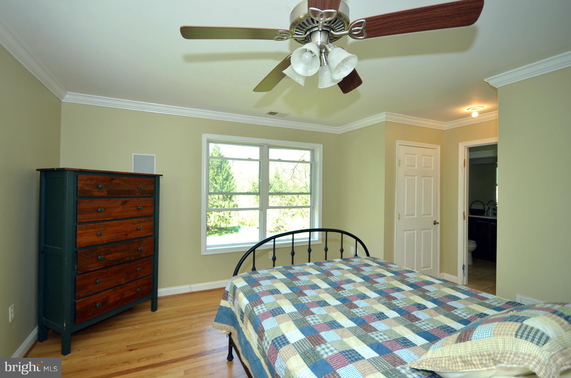 8010 Rider Avenue Baltimore, MD 21204 - Photo 15 of 29 a bedroom with a bed and a window
