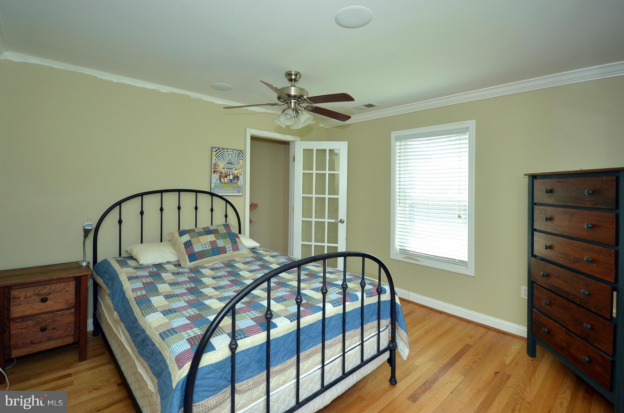 8010 Rider Avenue Baltimore, MD 21204 - Photo 16 of 29 a bed sitting in a bedroom next to a window