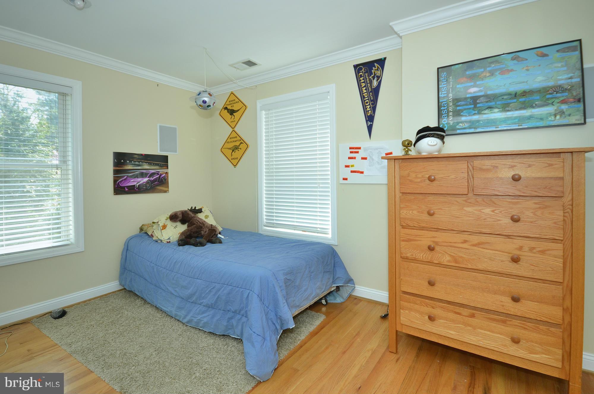 8010 Rider Avenue Baltimore, MD 21204 - Photo 17 of 29 a bedroom with a bed and a dresser