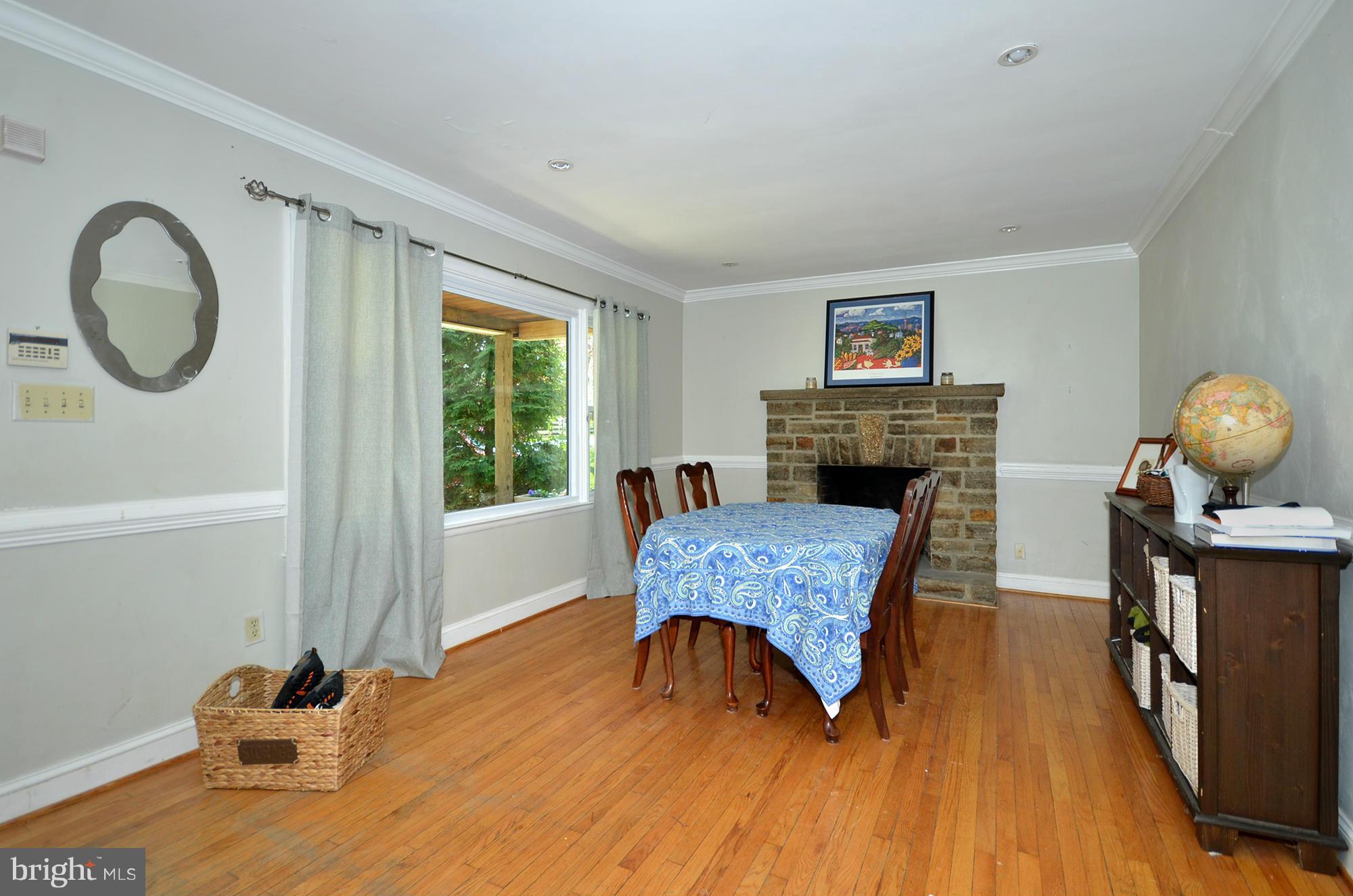 8010 Rider Avenue Baltimore, MD 21204 - Photo 5 of 29 a living room with furniture and a fireplace