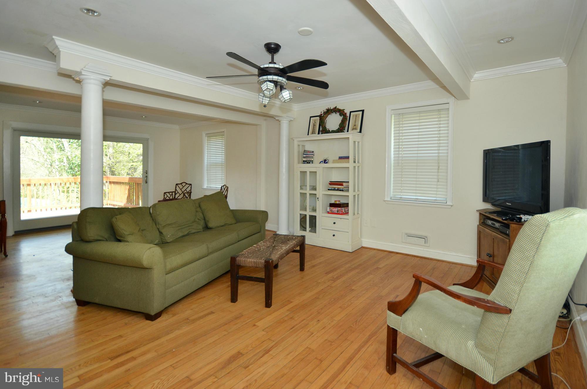 8010 Rider Avenue Baltimore, MD 21204 - Photo 7 of 29 a living room with furniture and a flat screen tv