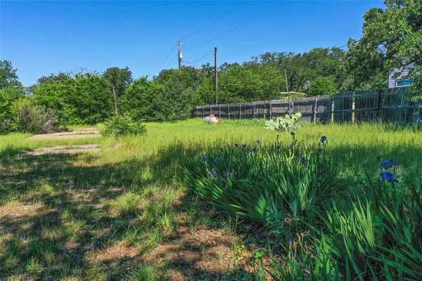 a view of a lake with a yard
