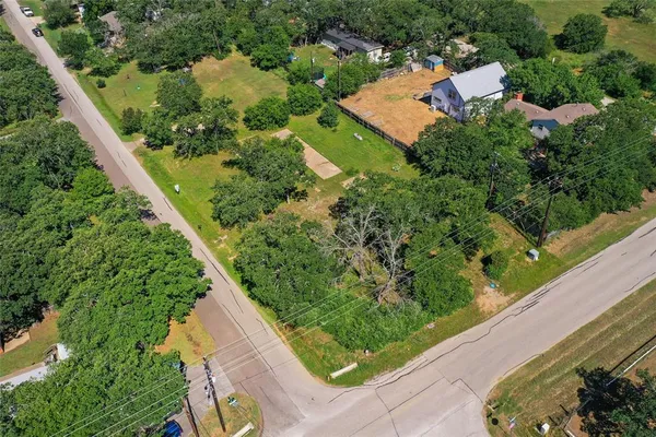 an aerial view of house with yard