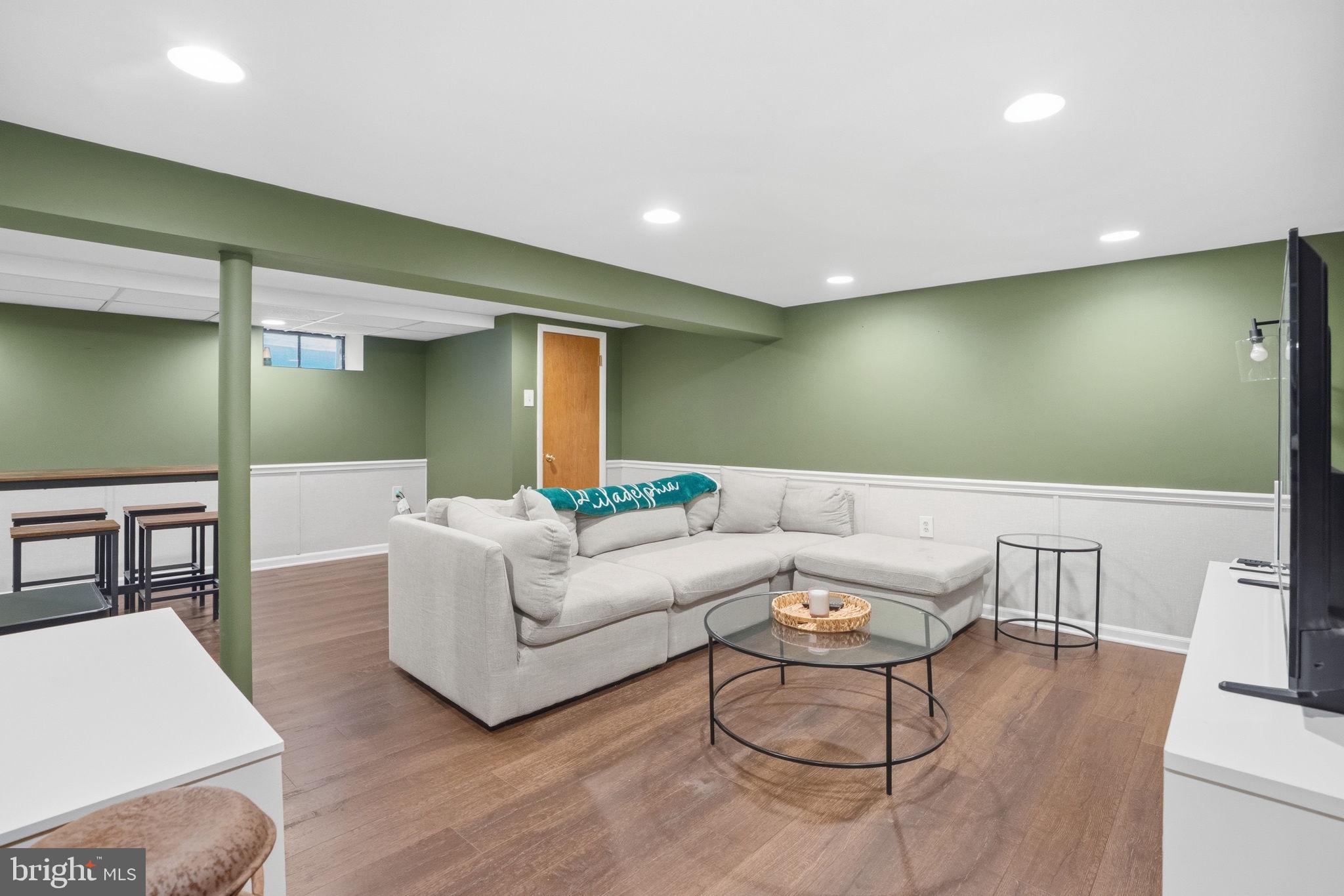 303 Radcliffe Road Glenside, PA 19038 - Photo 19 of 36 a living room with furniture and a wooden floor