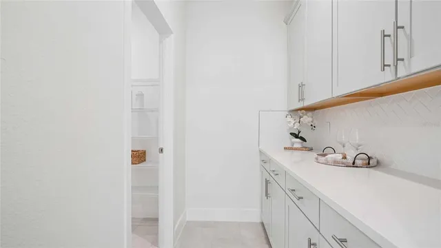 a bathroom with a sink and vanity