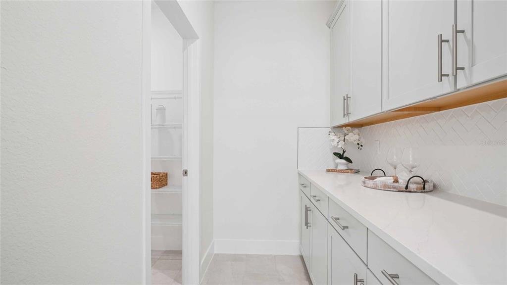 11269 Duckling Way Weeki Wachee, FL 34613 - Photo 11 of 33 a bathroom with a sink and vanity