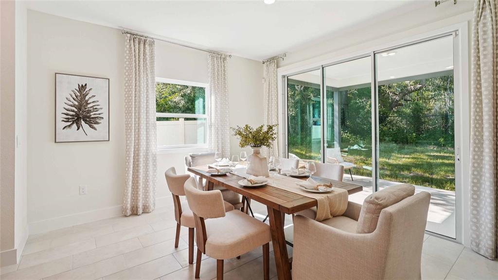 11269 Duckling Way Weeki Wachee, FL 34613 - Photo 13 of 33 a view of a dining room with furniture window and outside view