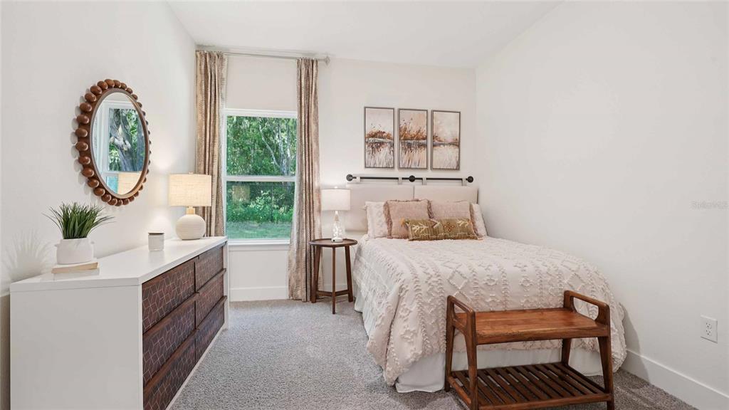 11269 Duckling Way Weeki Wachee, FL 34613 - Photo 14 of 33 a bedroom with a bed and a window