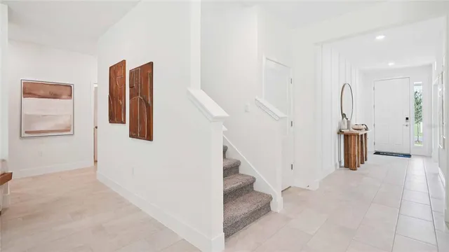 a living room with furniture and large window