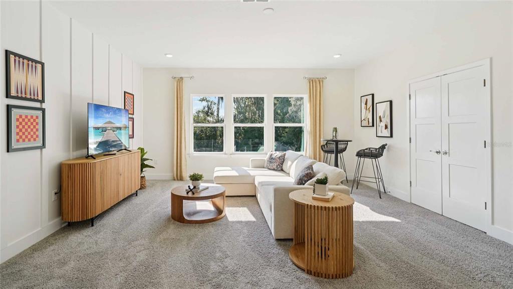 11269 Duckling Way Weeki Wachee, FL 34613 - Photo 19 of 33 a living room with furniture and a flat screen tv