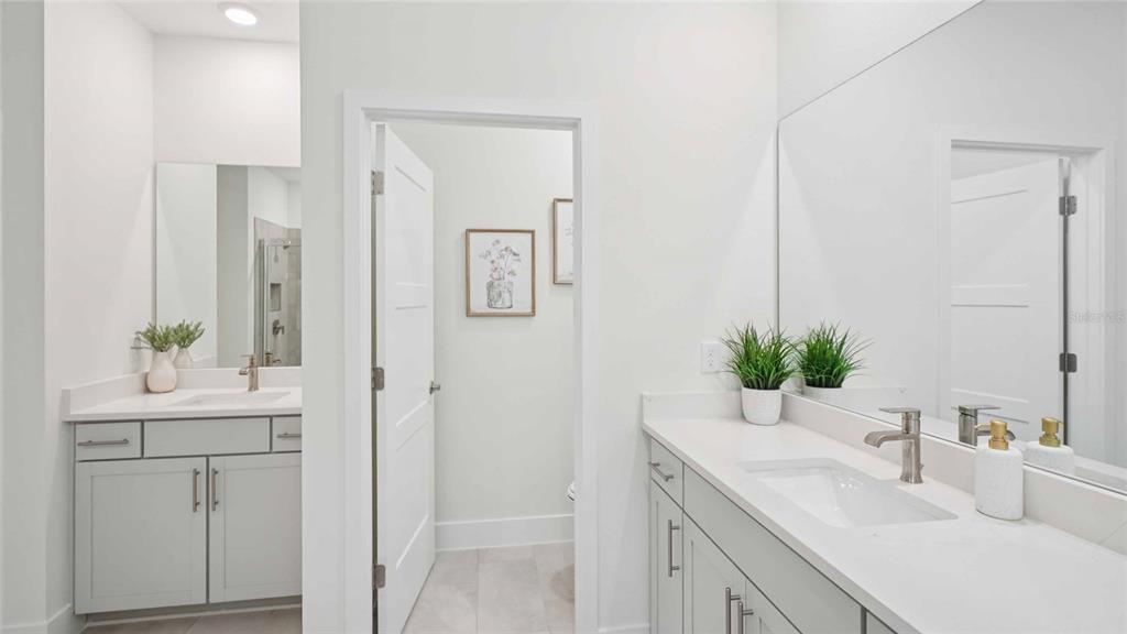11269 Duckling Way Weeki Wachee, FL 34613 - Photo 24 of 33 a bathroom with a sink a vanity and a mirror