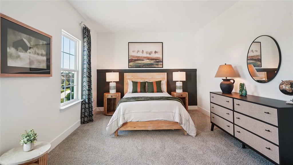 11269 Duckling Way Weeki Wachee, FL 34613 - Photo 28 of 33 a bedroom with a bed a dresser and window