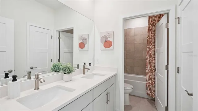 a bed room with a bed and a chair