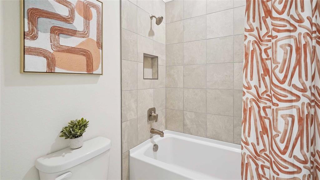 11269 Duckling Way Weeki Wachee, FL 34613 - Photo 30 of 33 a bathroom with a bathtub and shower