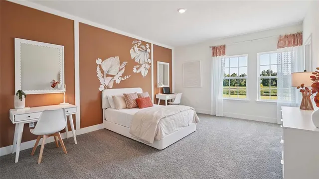 a view of a street with potted plants and big trees