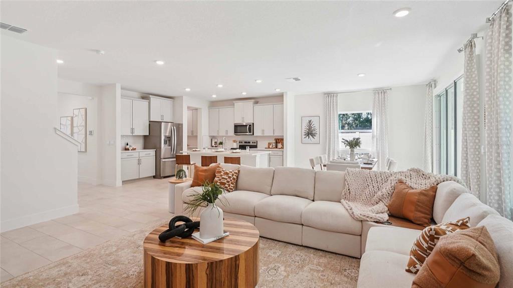 11269 Duckling Way Weeki Wachee, FL 34613 - Photo 6 of 33 a living room with furniture and a large window