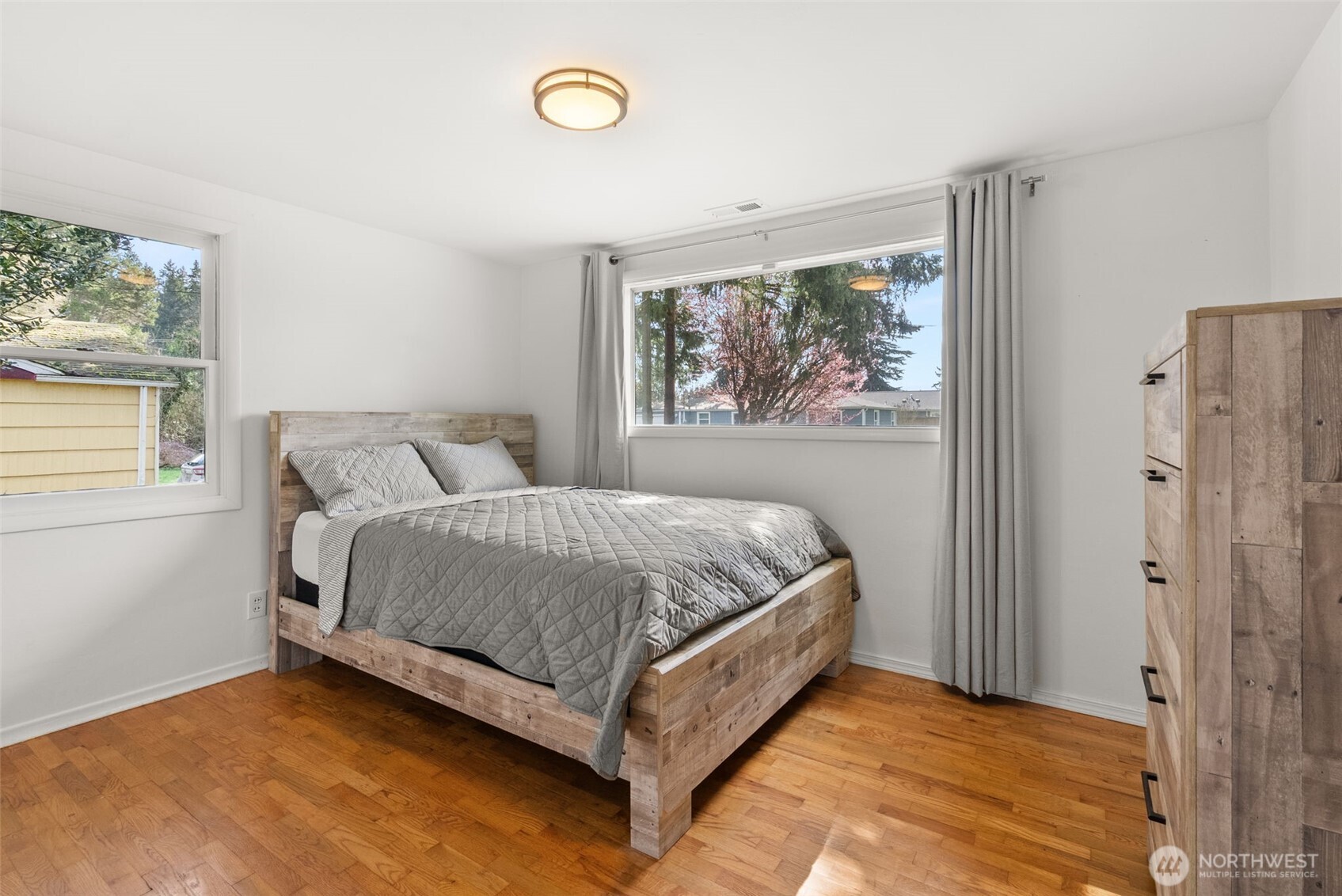 4532 14th Way Southeast Lacey, WA 98503 - Photo 11 of 22 a bed sitting in a bedroom next to a window