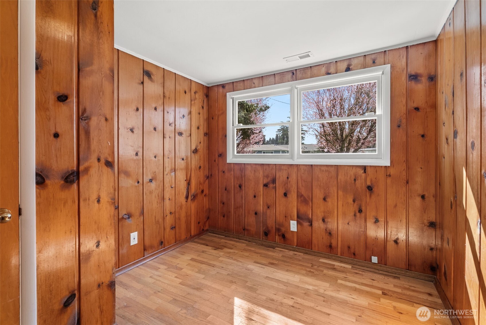 4532 14th Way Southeast Lacey, WA 98503 - Photo 13 of 22 a view of a hallway with paintings on the wall