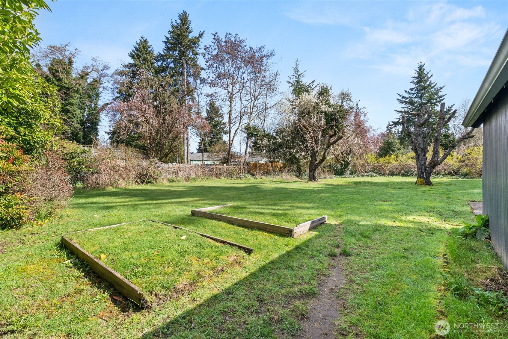 4532 14th Way Southeast Lacey, WA 98503 - Photo 18 of 22 a view of a golf course with a garden