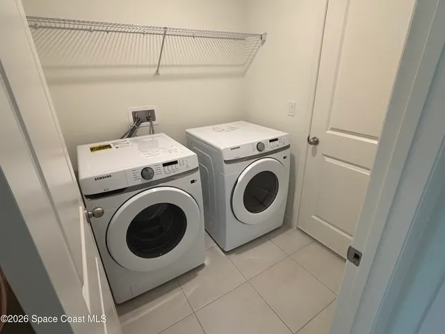 a utility room with dryer and washer