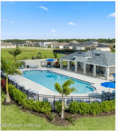 an aerial view of a house with a garden