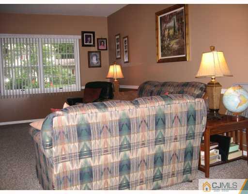 16 Surrey Road Somerset, NJ 08873 - Photo 6 of 8 a bedroom with bed and a window