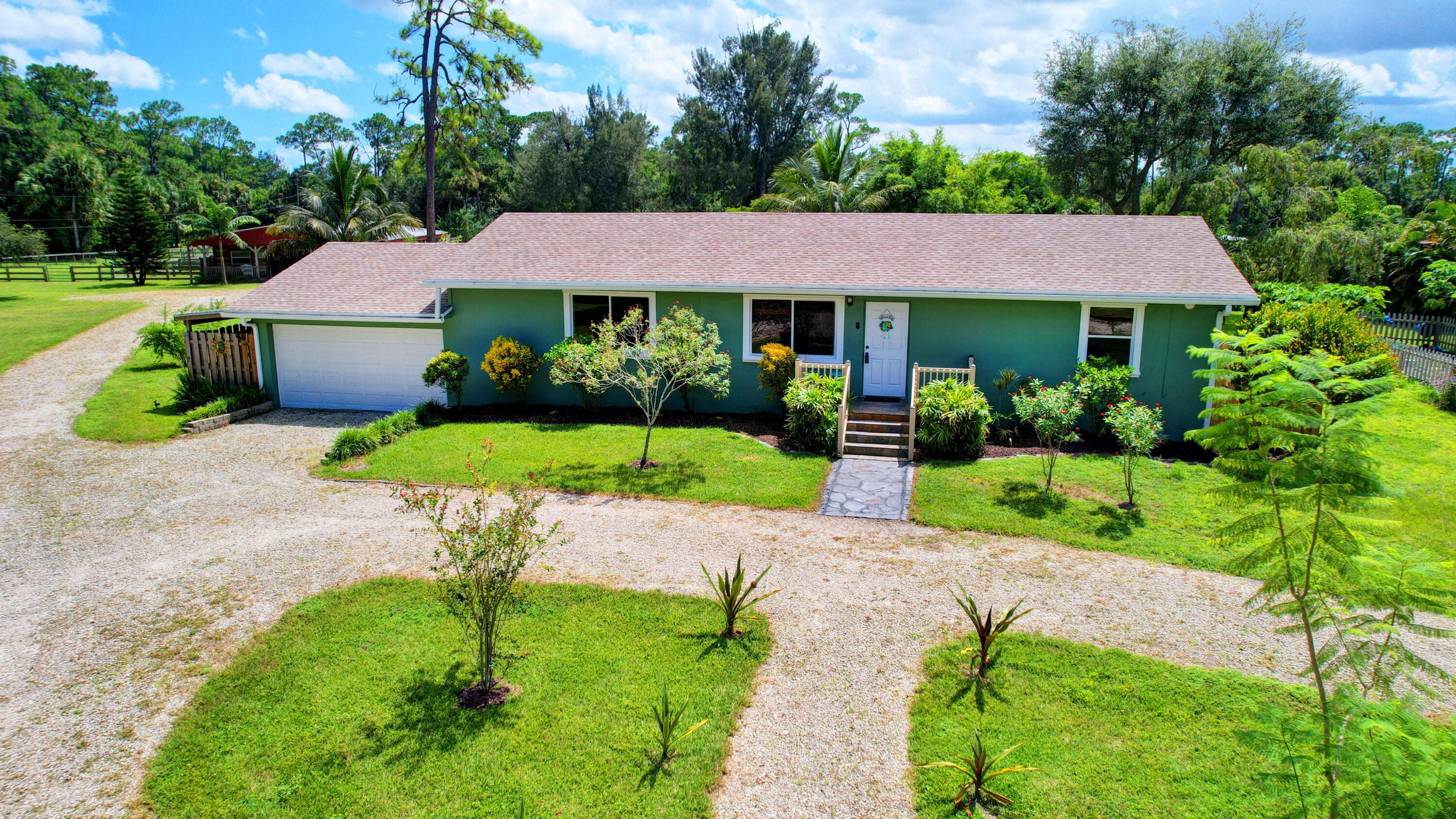 13598 N Road Loxahatchee Groves, FL 33470 - Photo 1 of 87 02_house air (2)