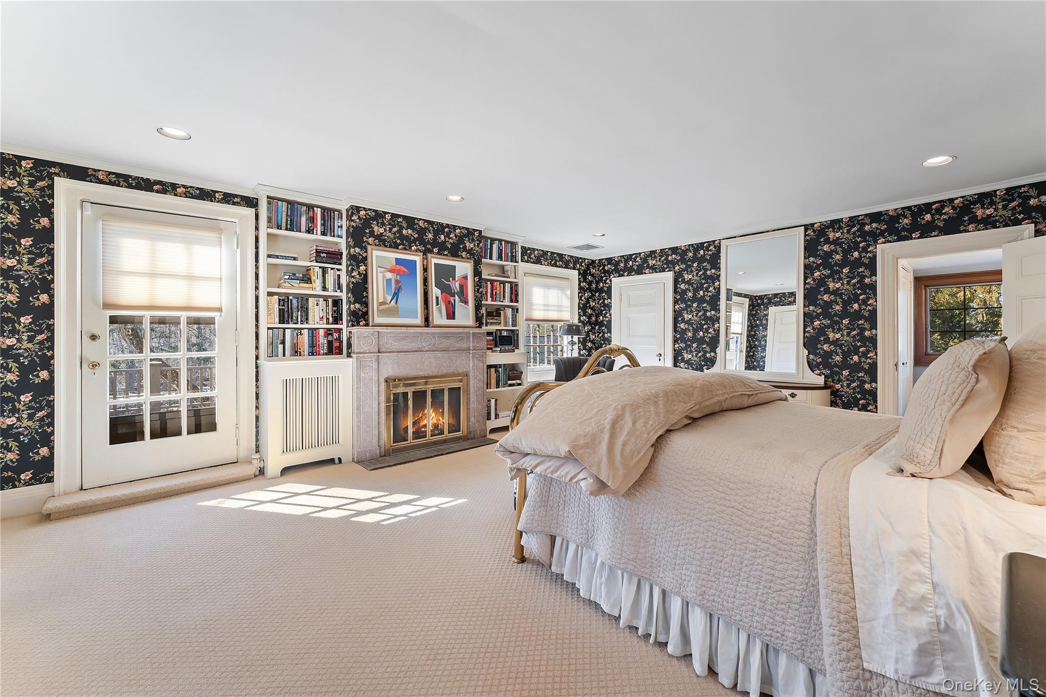 11 Mamaroneck Road Scarsdale, NY 10583 - Photo 19 of 38 Primary bedroom with wood burning fireplace and balcony