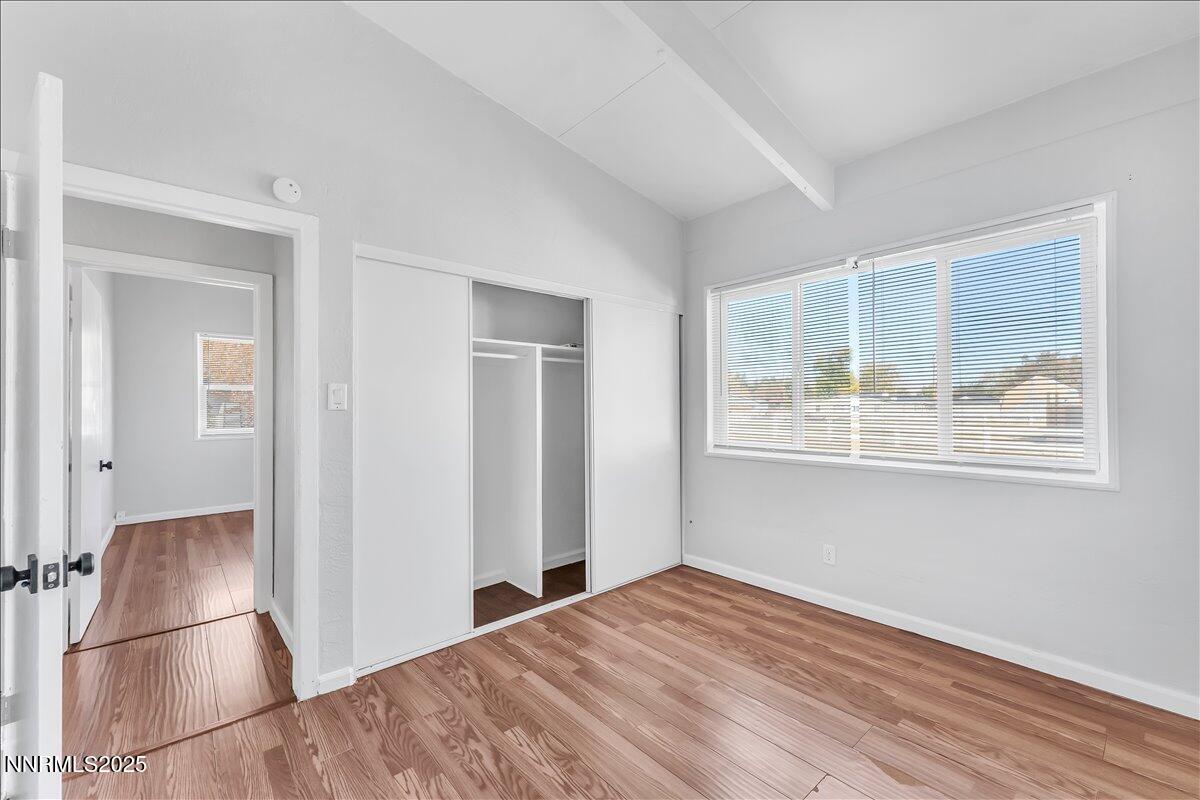 12123 Andes Street Reno, NV 89506 - Photo 14 of 24 a view of empty room with wooden floor and fan