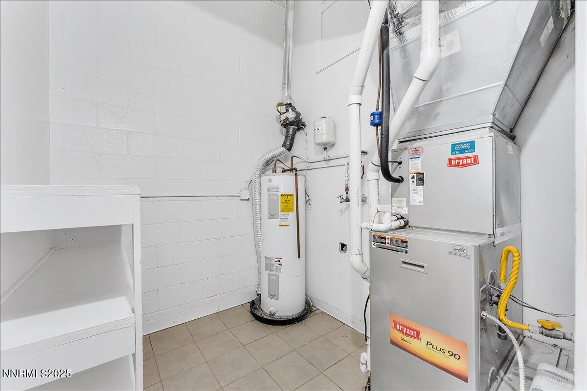 12123 Andes Street Reno, NV 89506 - Photo 15 of 24 a view of storage and utility room with refrigerator