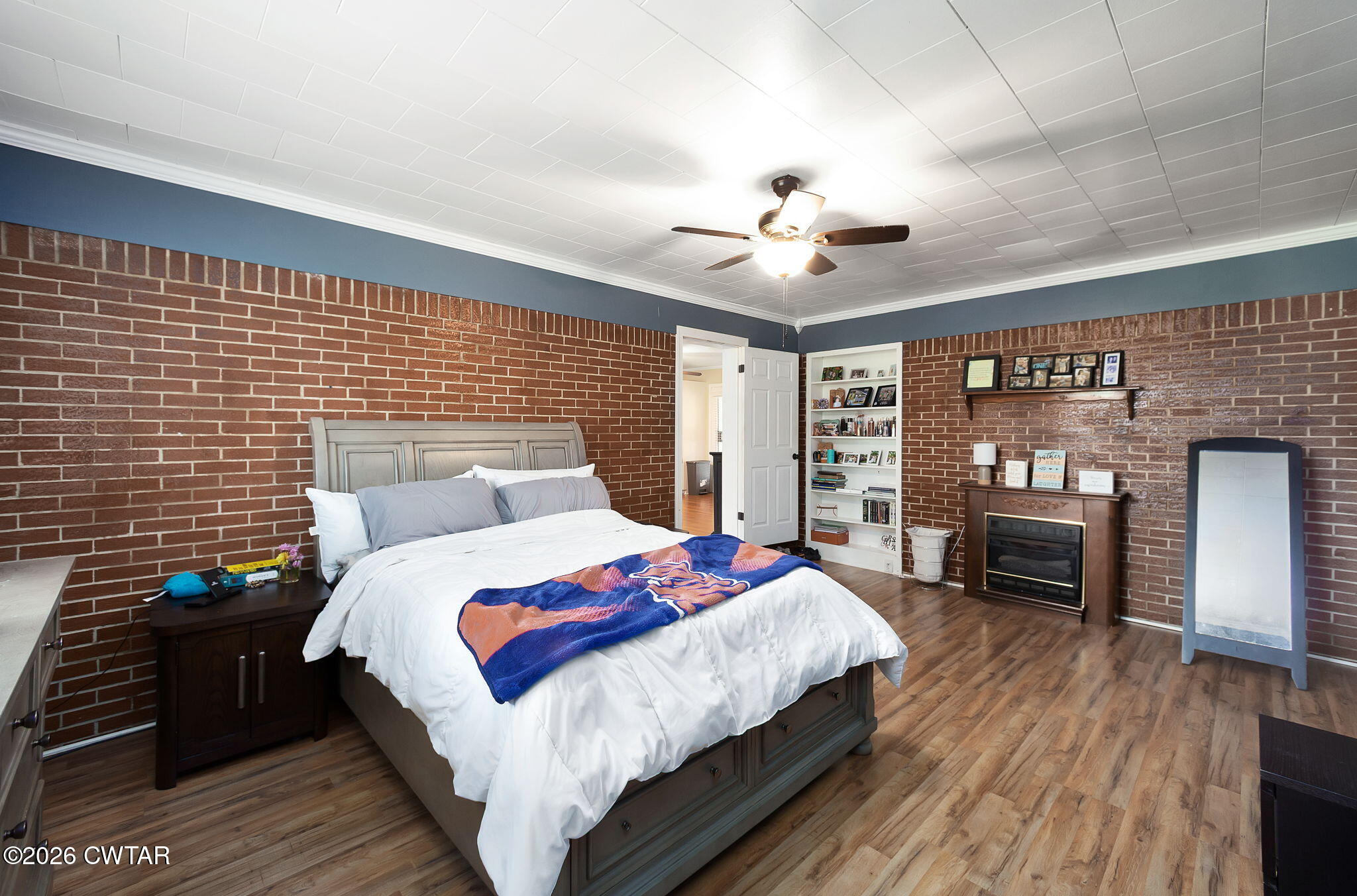 1921 Nance Road Alamo, TN 38001 - Photo 24 of 29 a bedroom with a bed and a fireplace