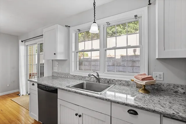 a kitchen with sink and window
